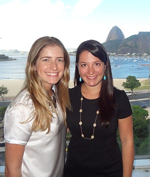 Lovallo and her business partner, Larissa Freire, in front of Sugarloaf Mountain in Rio de Janeiro