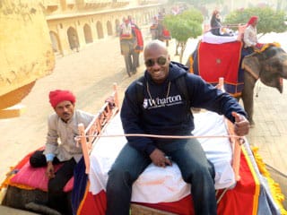 Lawrence riding an elephant to the Amer Fort in Jaipur