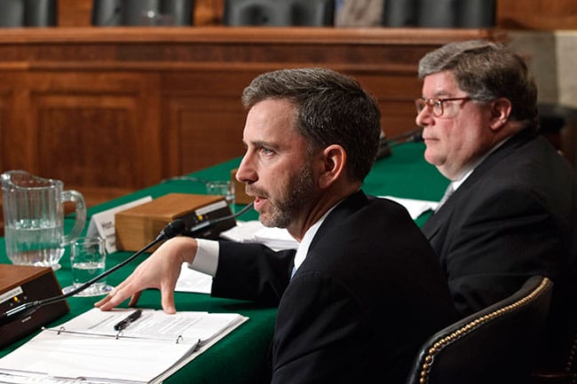 The General Services Administration’s Dan Tangherlini, WG’01 (center), then acting administrator, testifies before the Senate committee investigating the misuse of taxpayer money on April 18, 2012.
