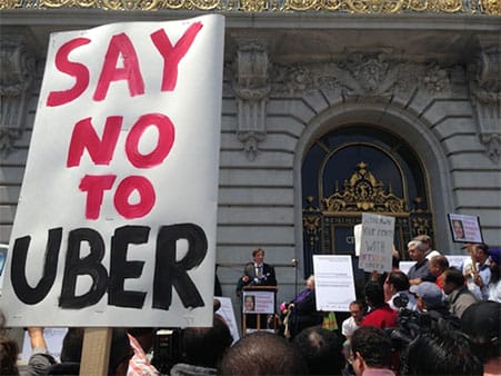 Taxi union members protest against ride-sharing services like Uber.