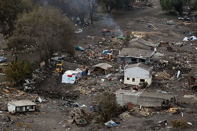 Homes that were destroyed are seen among debris over a week after the massive earthquake and tsunami on Feb. 27, 2010, in Constitution, Chile. Photo credit: Joe Raedle/Getty Images.
