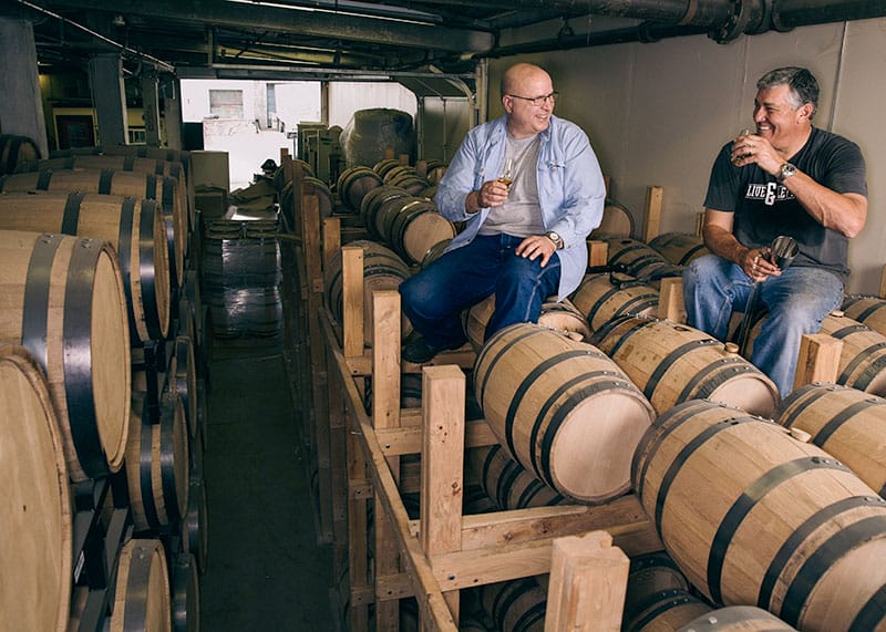 John Cooper (right) and Herman Mihalich enjoy the fermented fruit of their labor, Dad's Hat Pennsylvania Rye Whiskey, straight out of the barrel.
