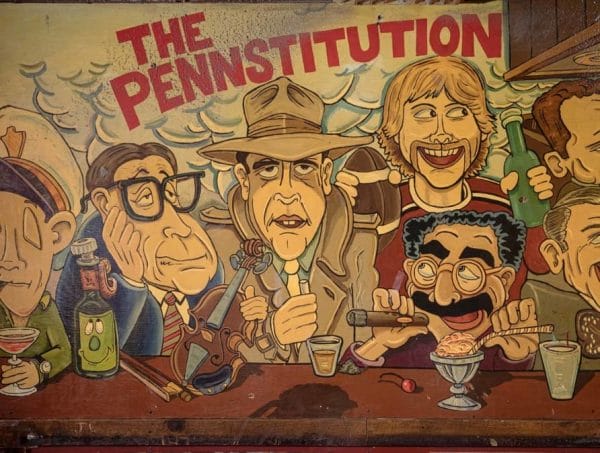 Mural of various bar-goers at Smokey Joe's, titled "The Pennstitution"