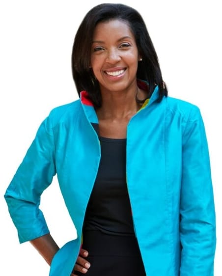 Wharton Dean Erika James poses wearing a light blue jacket and a black dress.
