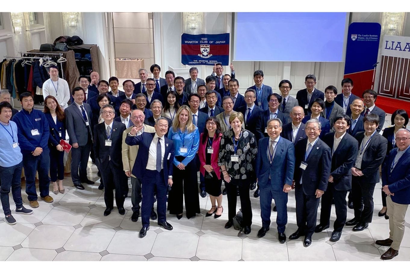 Members of the Wharton Club of Japan and leaders from the Lauder Institute pose for a wide group shot.