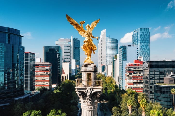 Photo of buildings and a statue in Mexico City