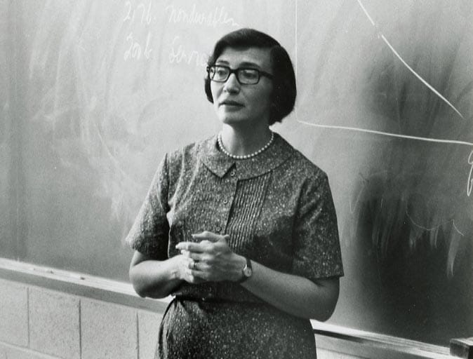 Anita Summers standing in front of a blackboard