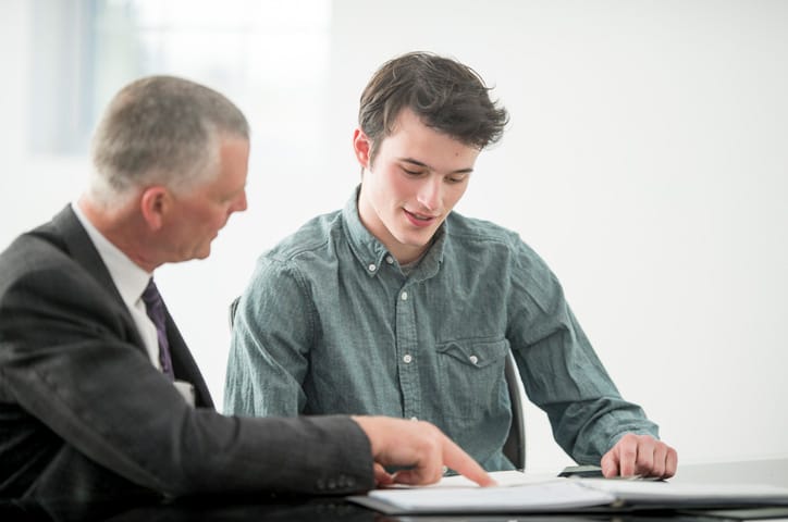 Senior executive mentors a younger employee