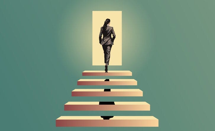 A woman in a business suit steps through a lit doorway.