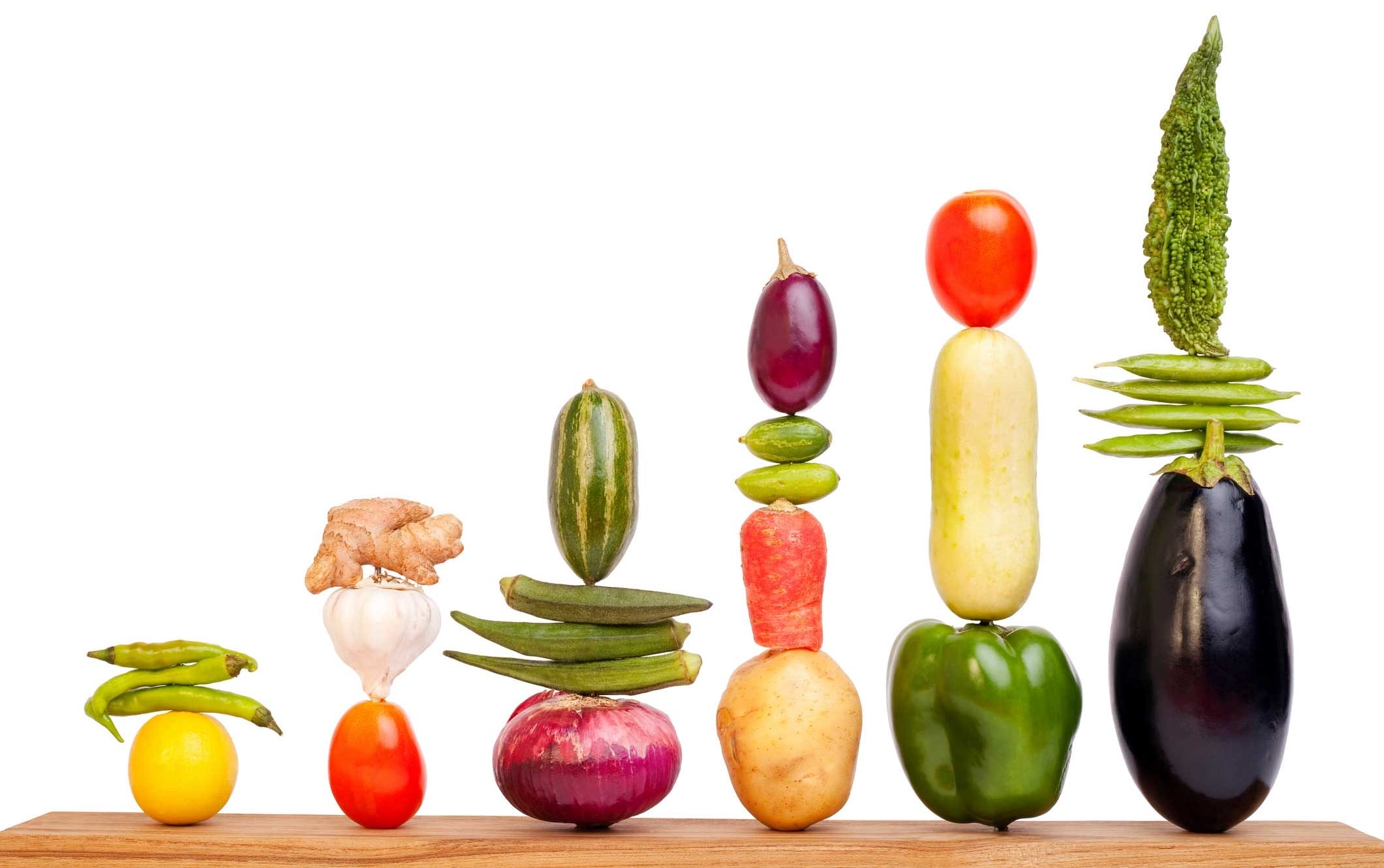 Vegetables stacked atop one another and arranged in a bar graph.