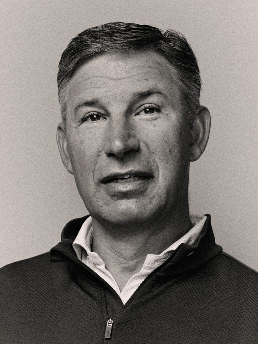 Portrait of Anthony Noto in a quarter-zip shirt looking slightly upward.