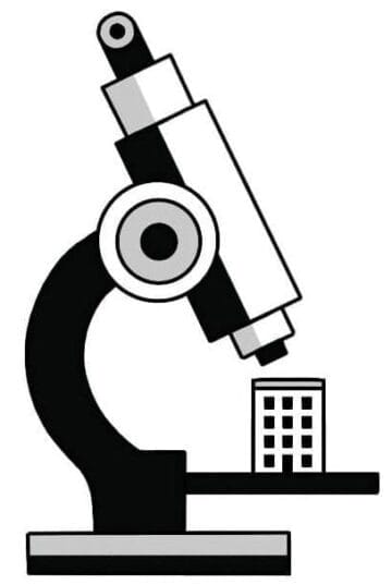 Illustration of a building sitting atop a microscope for observation.