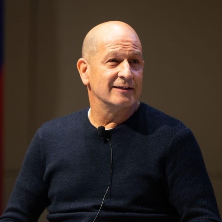 Photo of Bobby Turner seated at the front of an auditorium fora talk.