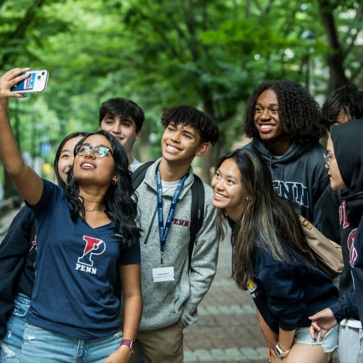 Students taking a selfie on Locust Walk.