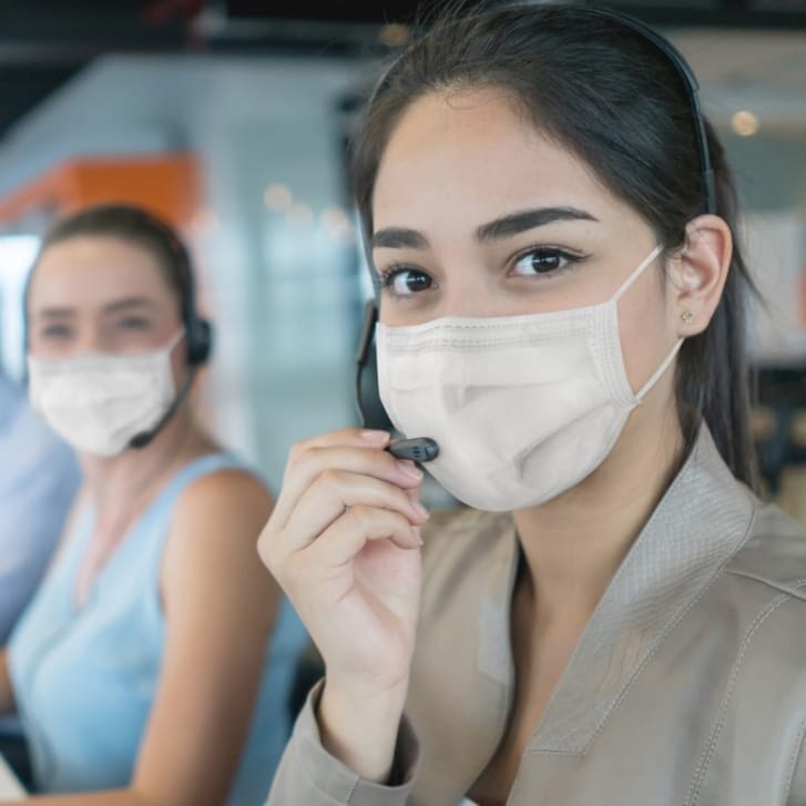 Call center workers with masks on