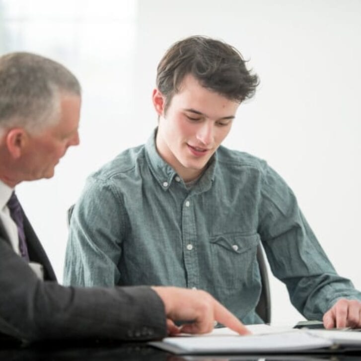 Senior executive mentors a younger employee