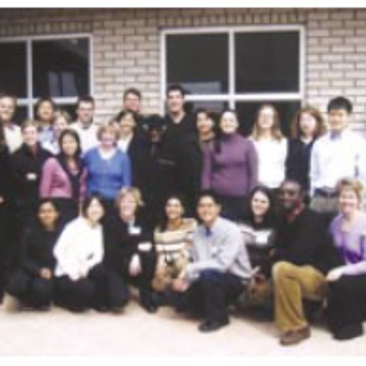 Members of the Wharton community pose together for a photo.