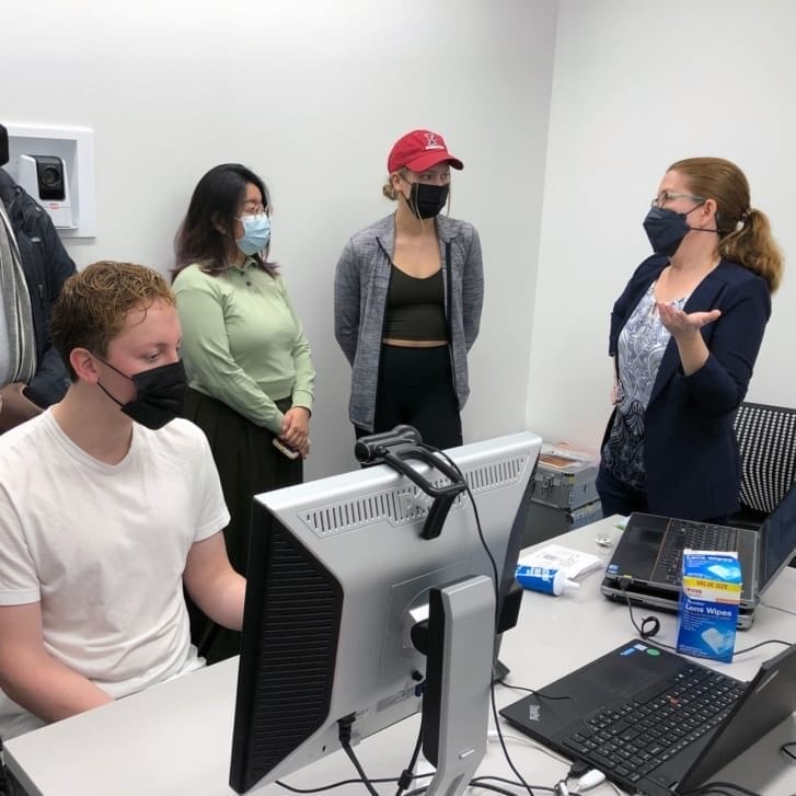 Wharton Neuroscience Initiative executive director Zab Johnson with students in the Wharton Behavioral Lab.