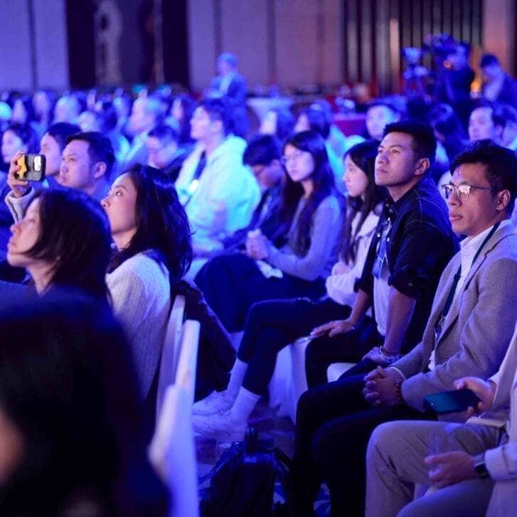 Audience members looking toward the stage in Shanghai