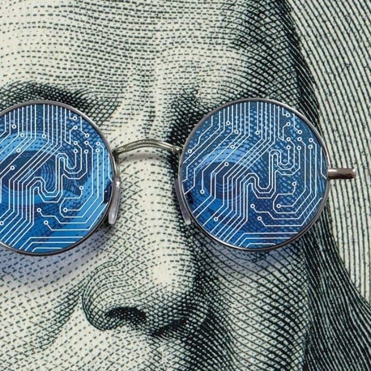 An illustration of Benjamin Franklin wearing glasses that have circuit boards as the lenses.