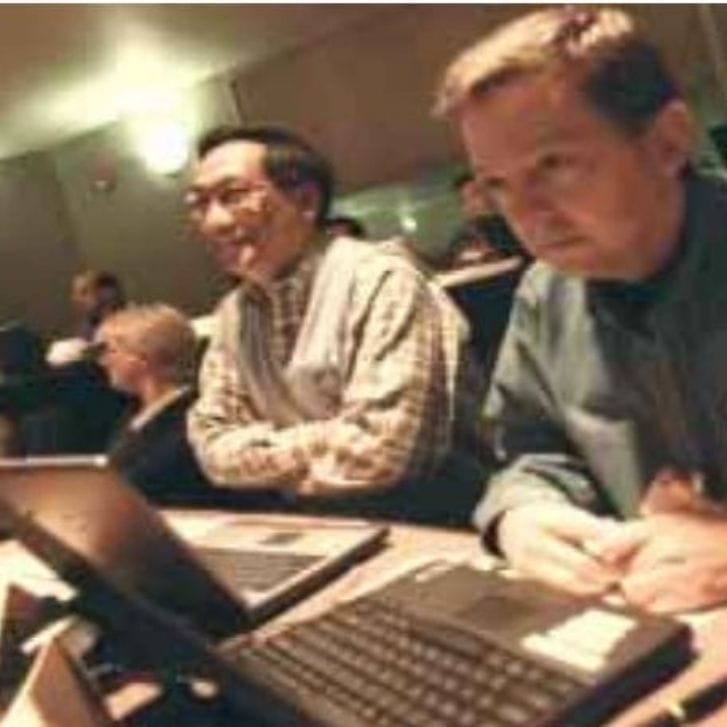 Group of students sitting together at desks.