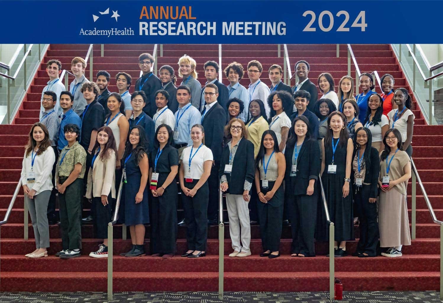 A group of students standing on stairs