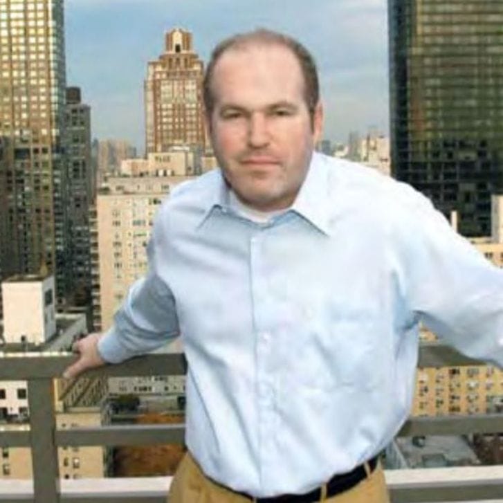 Cliff Asness posing on a balcony in New York