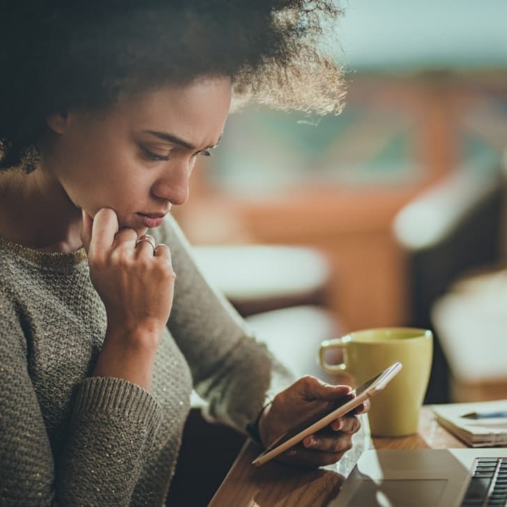 Woman looking at cell phone.