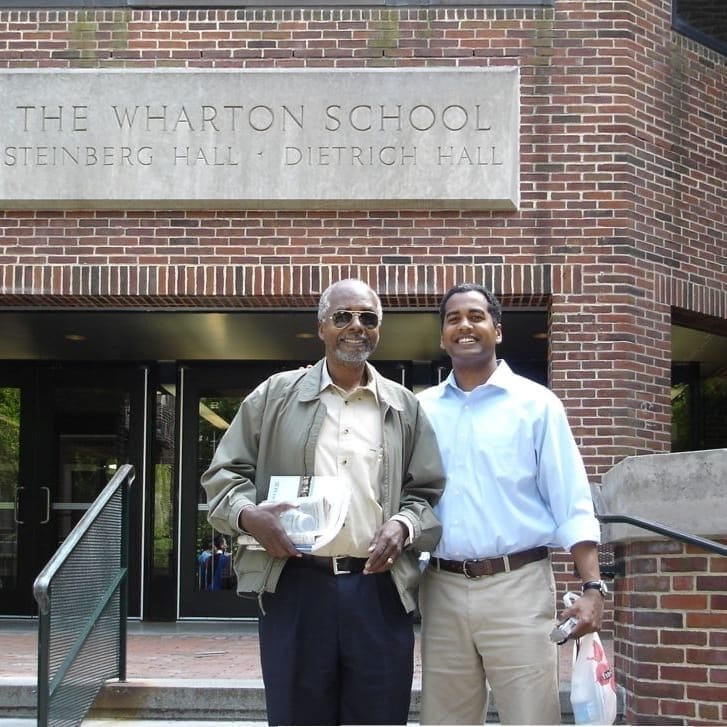 Father Harold Thomas and son Ahmad Thomas.