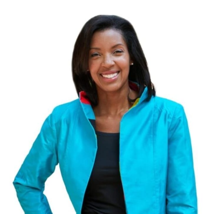 Wharton Dean Erika James poses wearing a light blue jacket and a black dress.