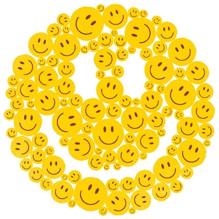 An illustrated smiley face made up of other smaller smiley faces.