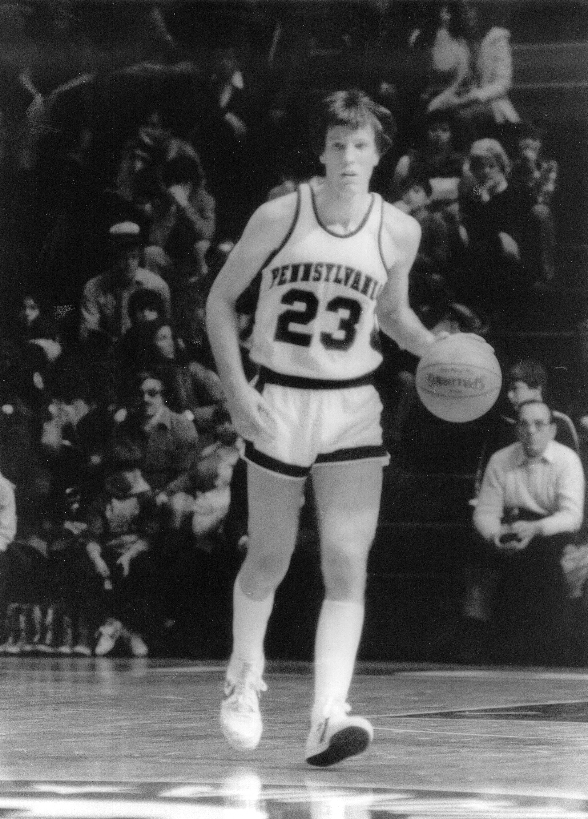 Black-and-white photo of a man playing basketball