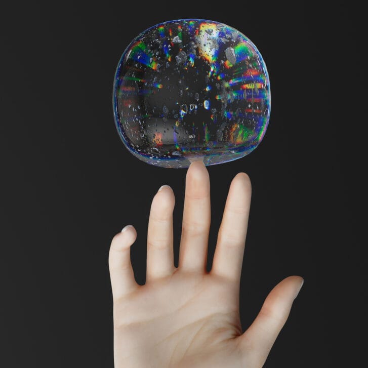 Hand balancing a bubble on its middle finger