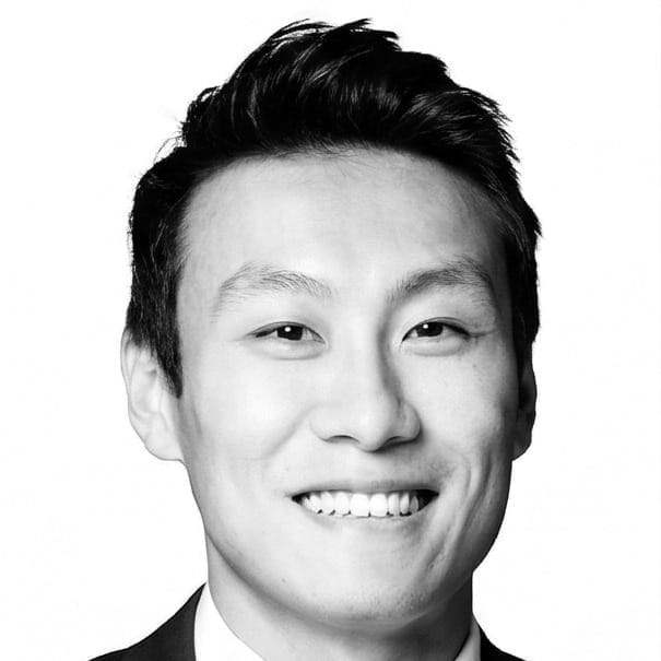Headshot of a man in a suit jacket.
