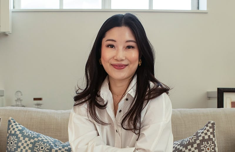 Woman sitting on a couch.