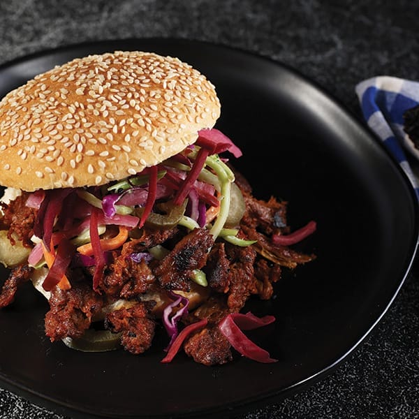 A plant-based burger on a plate.